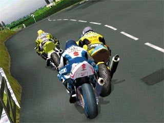 Screenshot from Suzuki TT Superbikes: Real Road Racing. featuring several motorcycles clustered together during a race.