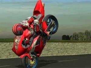 Screenshot from Suzuki TT Superbikes: Real Road Racing, featuring a rider on a red motorcycle doing a "stoppie"