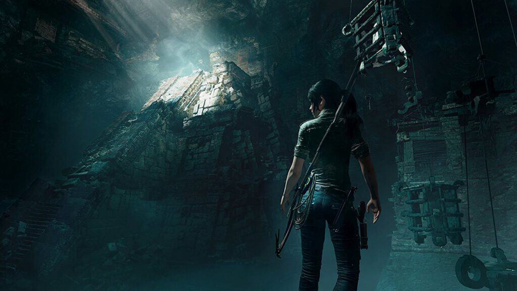 Lara Croft in Shadow of the Tomb Raider standing in cave