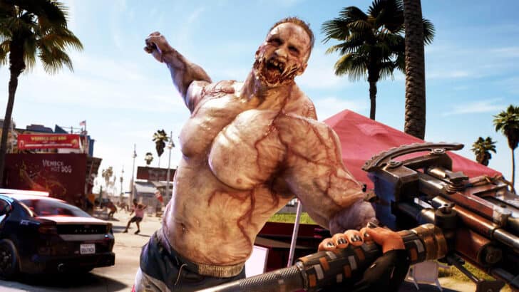 A Hulking zombie with raised fist comes at the main player from a first-person perspective