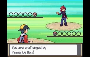 Promotional screenshot of a player battling a trainer in Pokemon SoulSilver