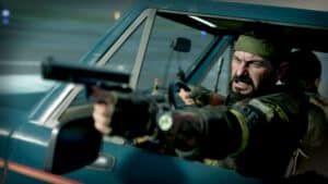 A Call of Duty character fires out of a car in Black Ops Cold War