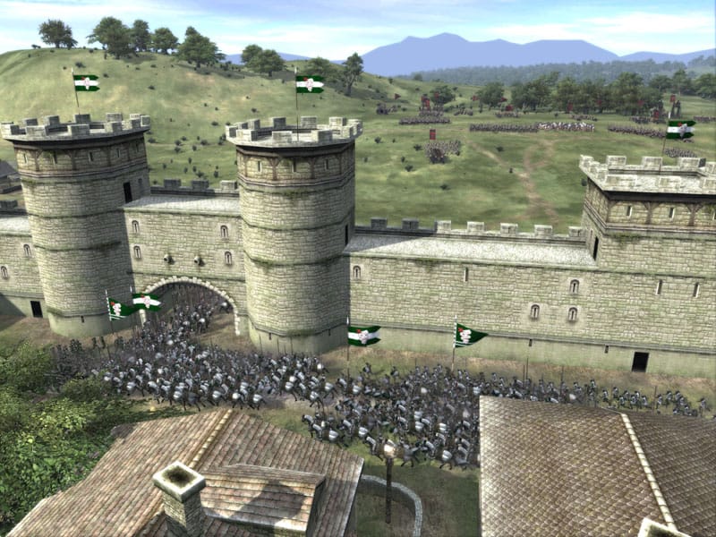 Units and a castle in Medieval II: Total War.