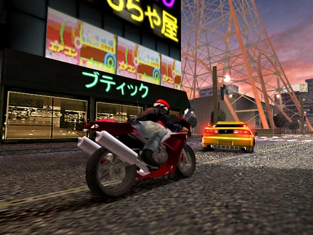 Bike and car racing in Midnight Club II in Tokyo.