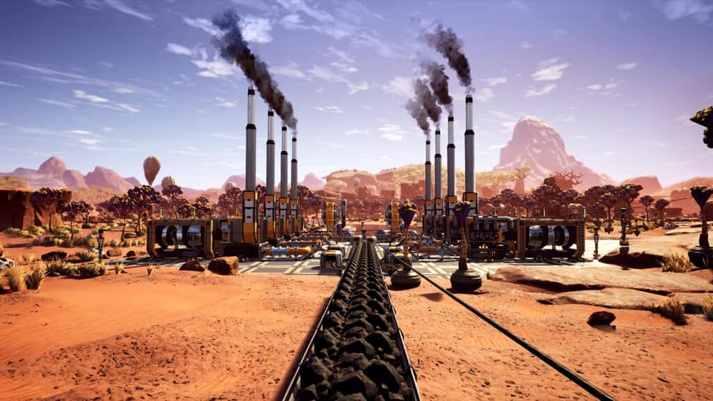A factory in Satisfactory's desert region pumps out smoke.