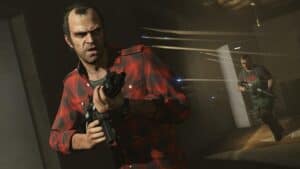 Trevor Philips with a gun in Grand Theft Auto V.