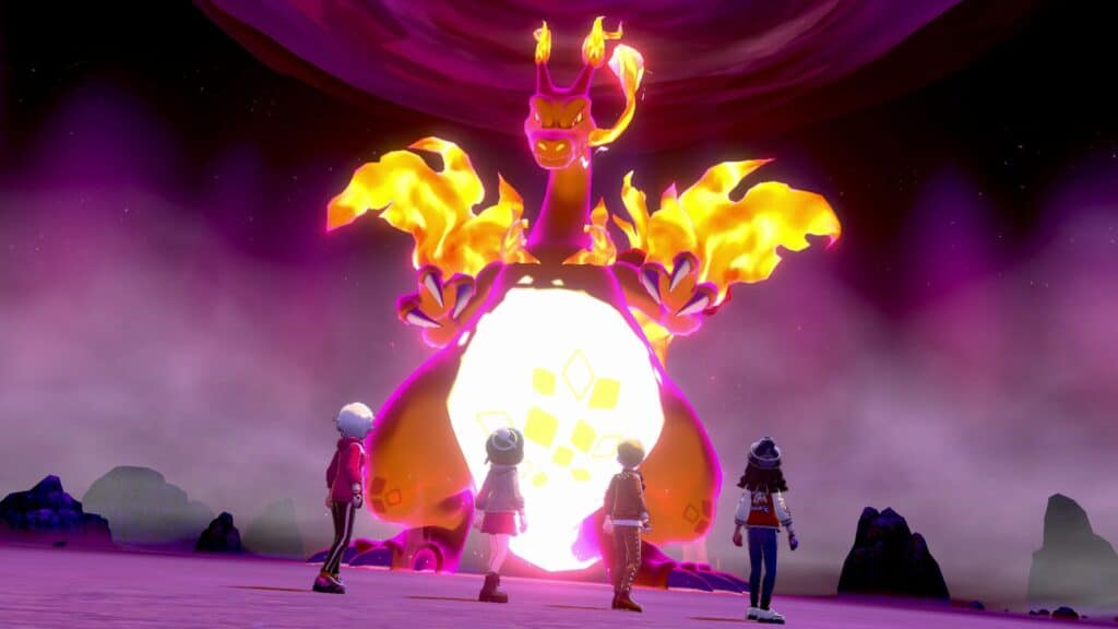 Trainers facing down Gigantamax Charizard in Pokemon Sword and Shield.