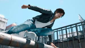 Judgment protagonist Takayuki Yagami leaps over a railing.