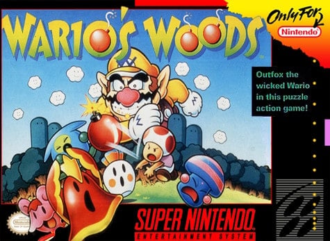 The cover for Wario's Woods shows the titular antagonist looming over the forest.