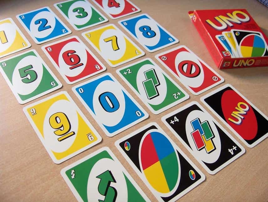 Uno cards displayed out on a table.