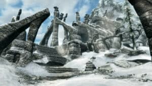 Ancient Nord ruins line a mountainside in Skyrim.